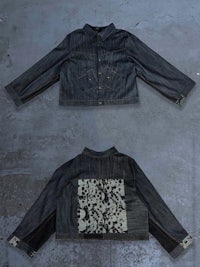 a pair of denim jackets with embroidered flowers on them